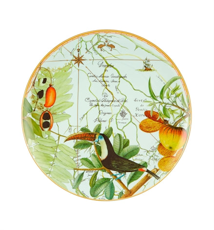 Vista Alegre | Amazonia Plate XL: Decorative porcelain plate featuring a toucan, tropical fruits, and a map-style background, blending botanical and travel motifs inspired by Amazonia.