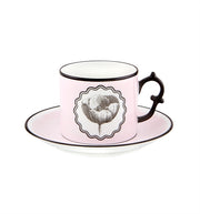 Vista Alegre | Lacroix - Herbariae Set features two pastel pink porcelain teacups with black rims, floral illustrations, and matching saucers, ideal for elegant tea settings.
