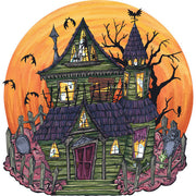 Hester & Cook Die-Cut Haunted House Placemat featuring a cartoon illustration of a green haunted house with a cemetery and bats, perfect for Halloween-themed table settings.