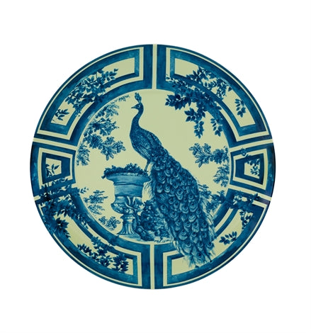 Vista Alegre | The Meaning XL Plate features a blue peacock with a flowing tail beside an urn, framed by geometric patterns, in a vintage style.