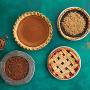 Nordic Ware | Naturals® High Dome Covered Pie Pan with oat-topped and plain pies displayed, highlighting its spacious dome, ideal for keeping pies fresh.