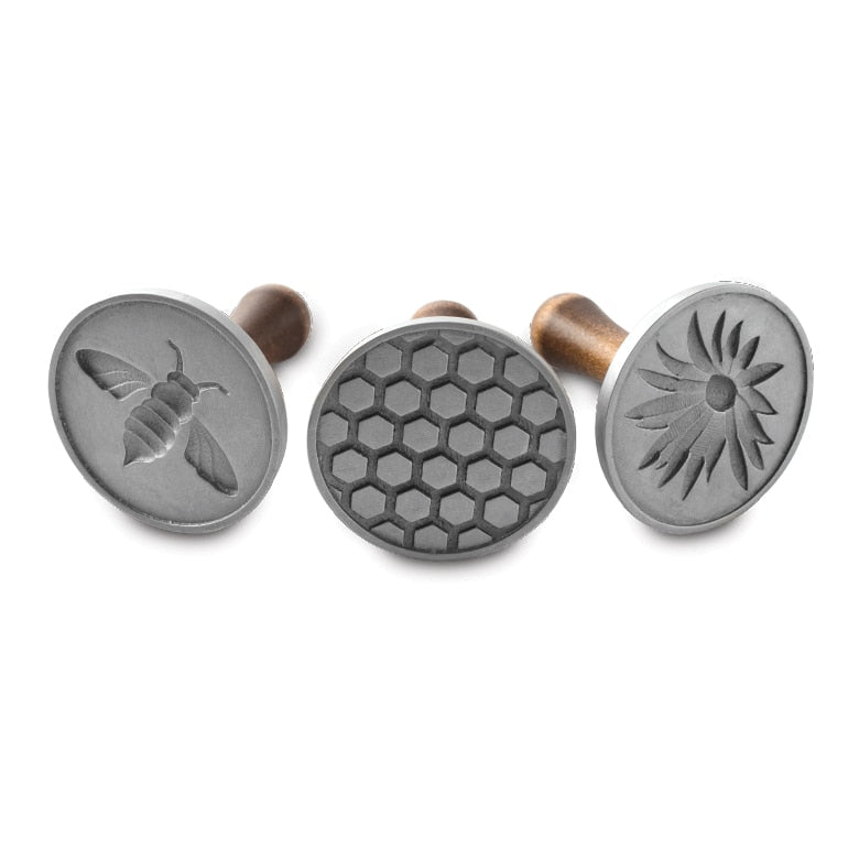 Nordic Ware | Honey Bees Cookie Stamps featuring bee, flower, and honeycomb designs for crafting detailed cookies. Ideal for spring-themed treats and bee enthusiasts.