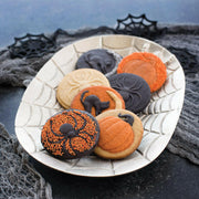 Nordic Ware Halloween Cookie Stamps - Cat with orange handles, featuring spider, pumpkin, and cat designs for festive baking imprints.