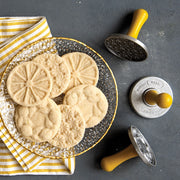 Nordic Ware | Citrus Cookie Stamps featured with a plate of cookies, emphasizing citrus-inspired designs ideal for enhancing flavors like Key Lime and lemon shortbread.