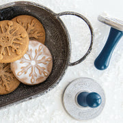 Nordic Ware | Snowflake Cookie Stamps - Set of 3, featuring cast aluminum stamps with wooden handles, ideal for creating embossed snowflake cookies for holiday gatherings or gifts.