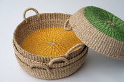 NEEPA HUT - Iris Tray I Yellow, a handwoven seagrass tray with a yellow circle design, ideal for serving or organizing, reflecting artisan craftsmanship from the Philippines.