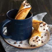 Nordic Ware | Norwegian Krumkake and Pizzelle Iron set with detailed press and wooden cone, ideal for crafting traditional Scandinavian and Italian cookies.