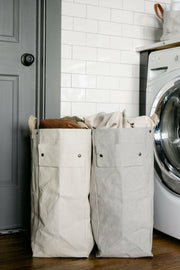 UASHMAMA Laundry Bag Hampers - Cachemire, showcasing a lightweight, washable paper design with cotton handles, perfect for stylish laundry organization in any space.