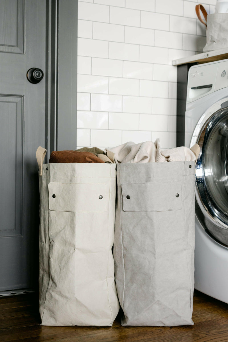 UASHMAMA Laundry Bag Hampers - Cachemire, showcasing a lightweight, washable paper design with cotton handles, perfect for stylish laundry organization in any space.