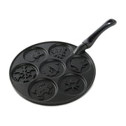 Nordic Ware | Holiday Pancake Pan features festive designs, making seven 3-inch pancakes at once, ideal for joyful breakfasts.