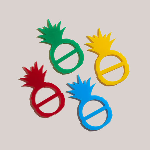 Atelier Saucier | Pineapple Napkin Ring Set, featuring stylized pineapple cutouts, perfect for vibrant table settings. Ideal for tiki-themed gatherings from Athens Cooks.