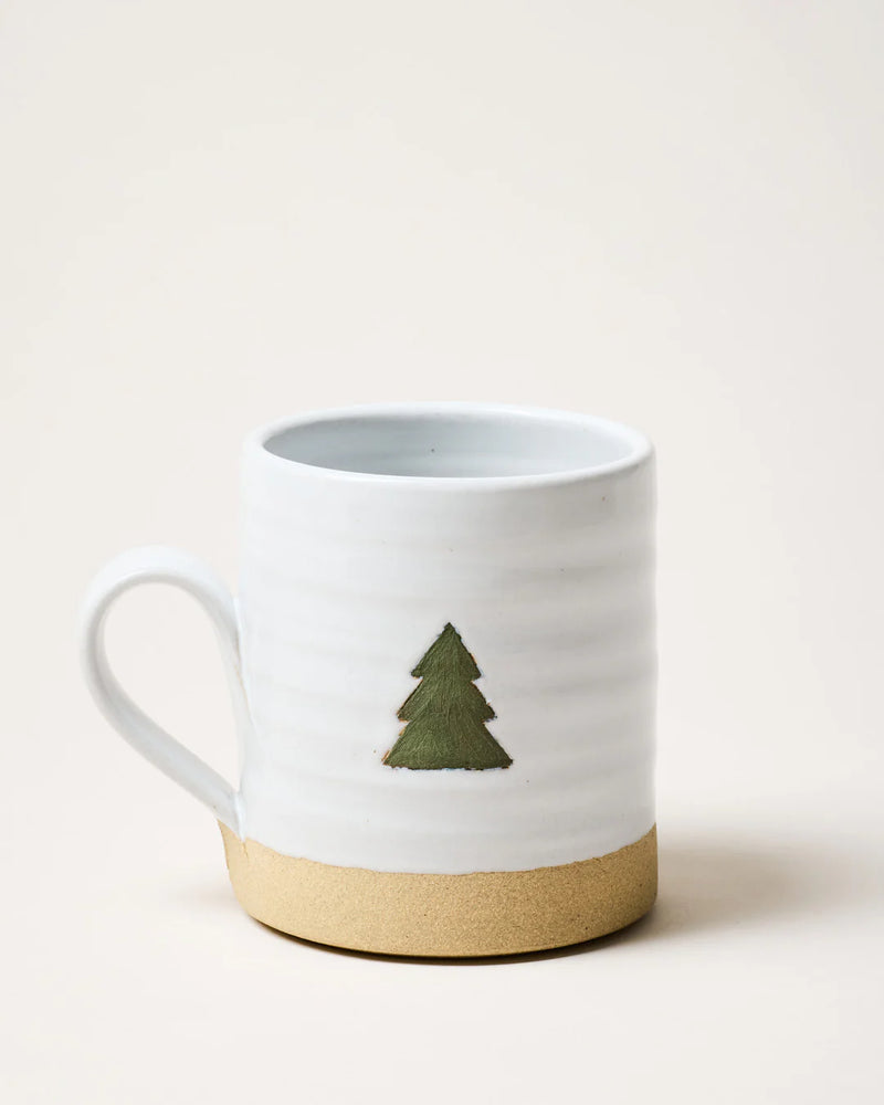 Farmhouse Pottery | Collector's Edition Evergreen Mug featuring a white glaze, natural clay base, and green pine-tree graphic, perfect for Athens Cooks' curated kitchen collection.