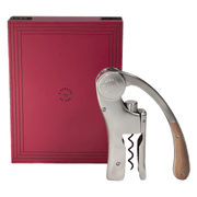 L'Atelier du Vin - USA - Lever Wine Opener - OENO MOTION TRESOR, a stainless-steel corkscrew with wooden handle, beside its elegant engraved presentation box.