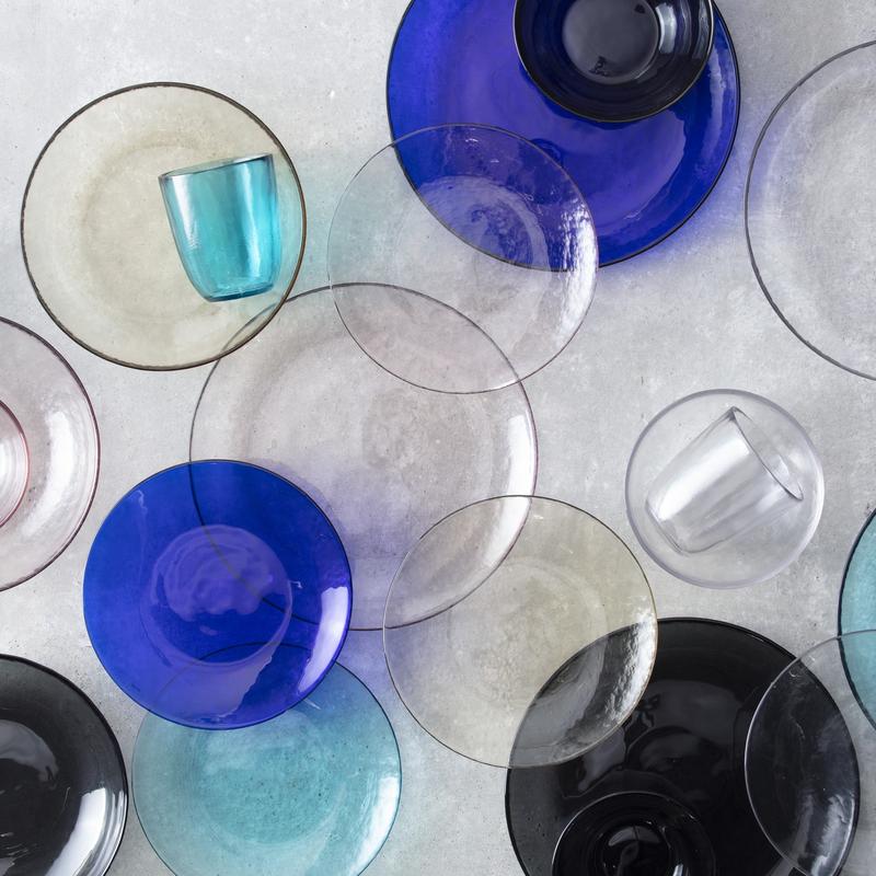 Zwiesel Fortessa | Los Cabos Clear 21oz Cereal Bowl, 6 Inches, elegantly layered among translucent glass dinnerware, showcasing its sturdy, textured design ideal for versatile dining.