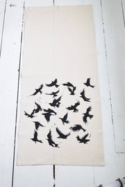 Hearth and Harrow - Organic Cotton Flying Crows Tea Towel showcases black bird silhouettes on eco-friendly fabric, ideal for both kitchen utility and fine dining elegance.