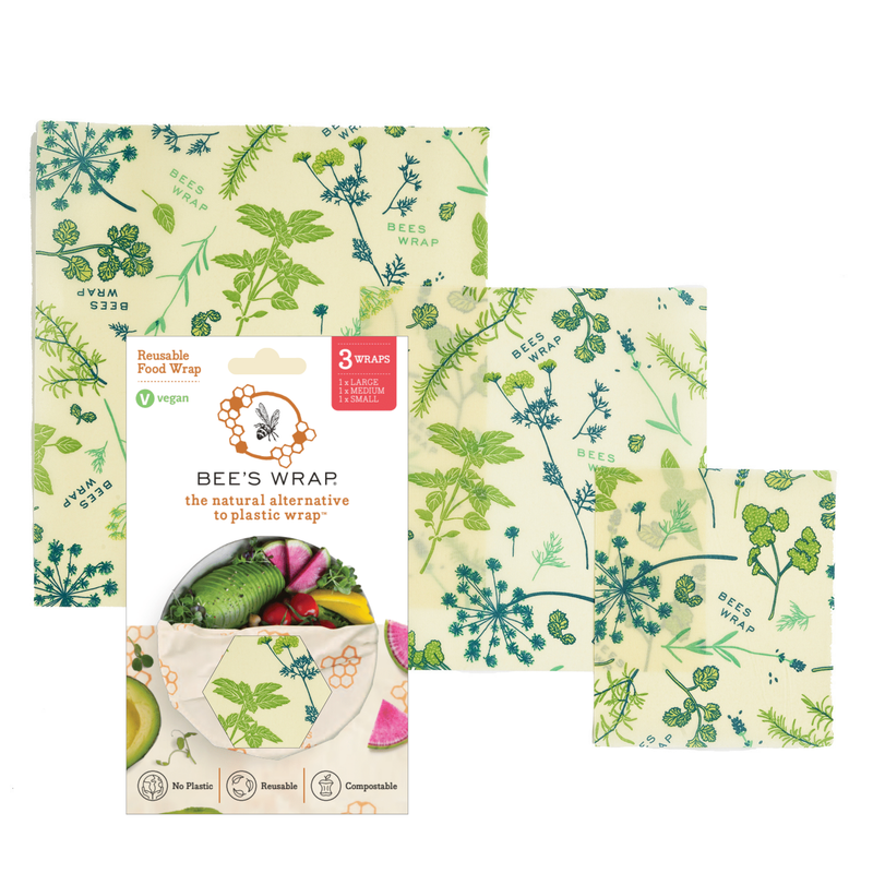 Bee's Wrap - Assorted 3 Pack - Herb Garden, Plant Based Wax, featuring reusable wraps with plant illustrations and a bee motif, ideal for preserving fresh produce and herbs.