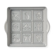 Nordic Ware | English Shortbread Pan, featuring intricate flower and fruit designs, perfect for baking crisp, buttery treats. Silver square tray for elegant presentation.