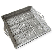 Nordic Ware | English Shortbread Pan, a square silver tray featuring intricate flower and fruit designs for creating delicate shortbread cookies.