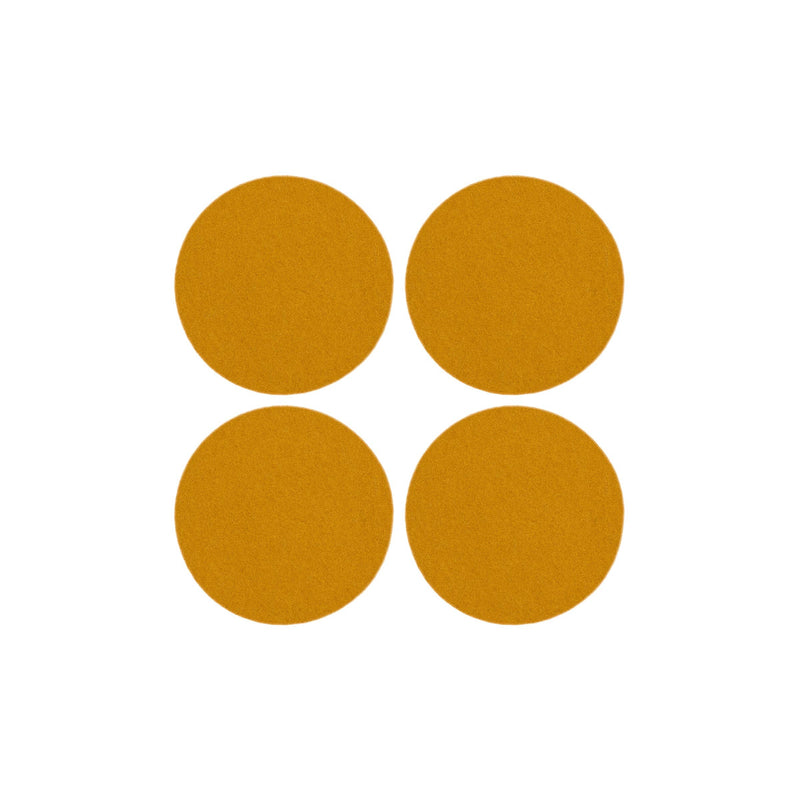 Graf Lantz - Bierfilzl Merino Wool Felt Round Coaster Solid 4 Pack: Turmeric, featuring four round, thick wool felt coasters ideal for protecting surfaces.