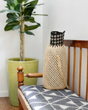 NEEPA HUT - Hanging Storage Basket, woven with indigenous zig-zag patterns, suitable for storing yoga mats, produce, or home items, crafted from bamboo/rattan.