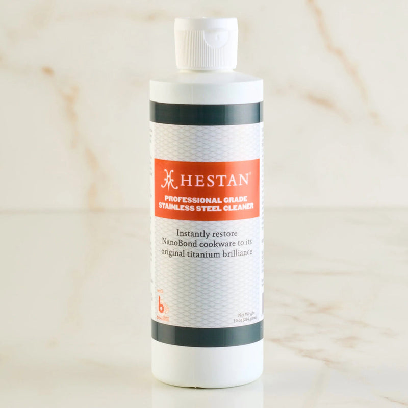 Hestan | Professional Stainless Steel Cleaner, a 10 oz. bottle, designed to restore NanoBond cookware's titanium-like brilliance by removing discoloration from high heat and residue.