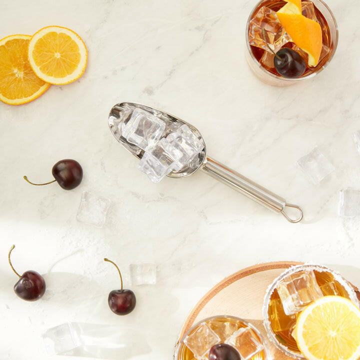 RSVP | Scoops - Large: A polished scoop with ice cubes, ideal for portioning, featuring a hanging loop for easy storage.