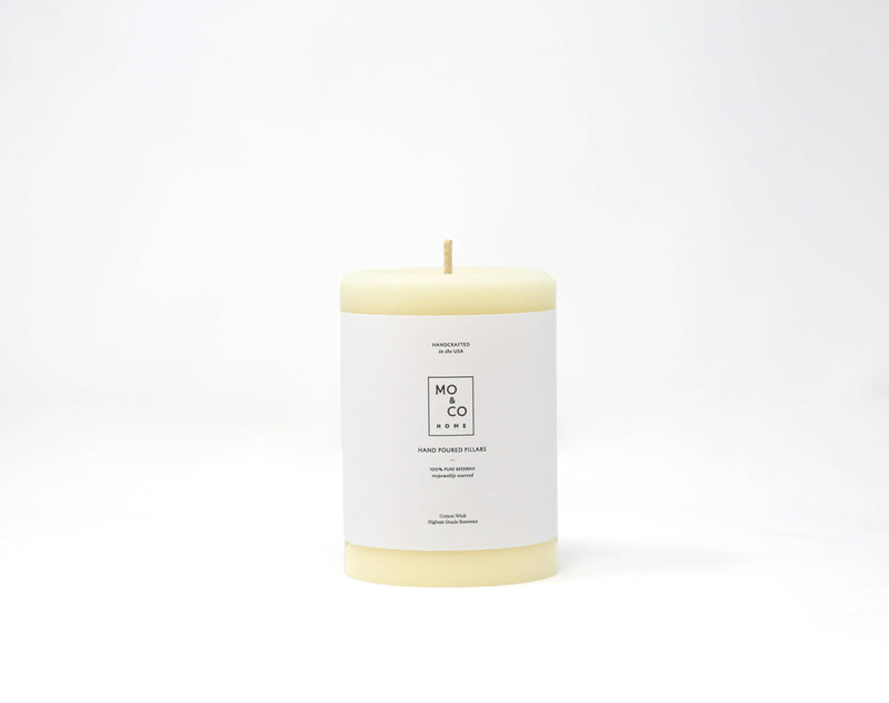 Mo&Co Home - 100% Beeswax Pillar Candles | Natural White: 3x6 Inch, featuring a white label, showcasing eco-friendly craftsmanship and a clean burn.