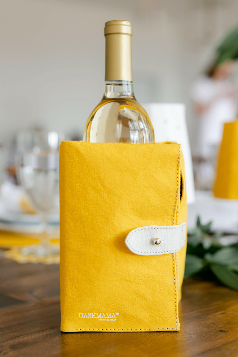 UASHMAMA Ice-Cube Beverage Chiller cradling a wine bottle, showcasing its ergonomic design and removable ice packs for stylish, long-lasting chilling.