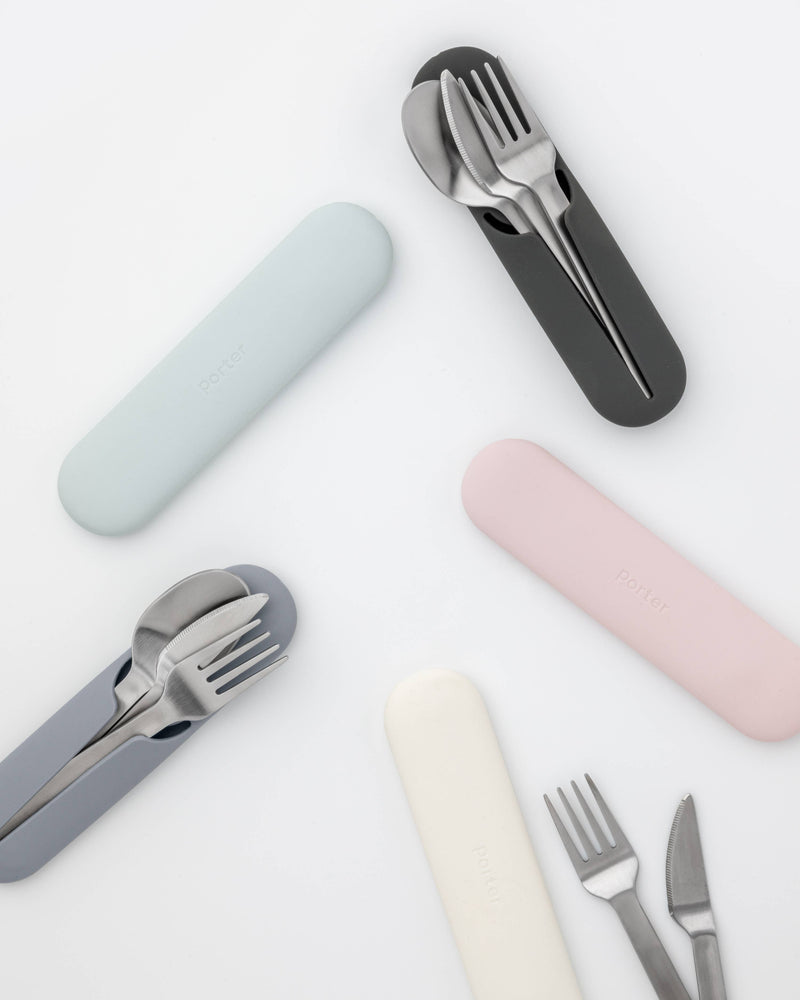 W&P - Stainless Steel Utensils Set in Silicone Carry Case: Terrazzo Charcoal, featuring a fork, knife, and spoon neatly arranged in a compact silicone holder, perfect for travel.