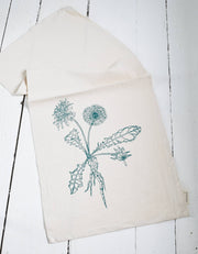Hearth and Harrow - Organic Cotton Dandelion Tea Towel with a green botanical print, featuring a detailed dandelion design, perfect for kitchen use.