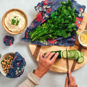 Bee's Wrap - Cut-to-Size Roll - Botanical Print used for wrapping parsley during Mediterranean snack preparation, emphasizing sustainable, eco-friendly food storage.