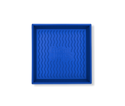 Great Jones | Square One - Blueberry: A 9x9-inch blue baking pan with a wavy, corrugated bottom for easy release, featuring nonstick, nontoxic coating.