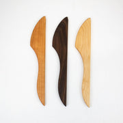 Collin Garrity wooden spreader knives in cherry, walnut, and maple, with ergonomic handles for spreading cheese and butter, reflecting Athens Cooks' curated kitchen tool selection.