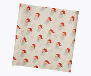 Rifle Paper Co. - Santa Continuous Wrapping Roll features vintage Santa faces, Merry Christmas in gold script, and gold stars on cream, perfect for festive gift-wrapping.