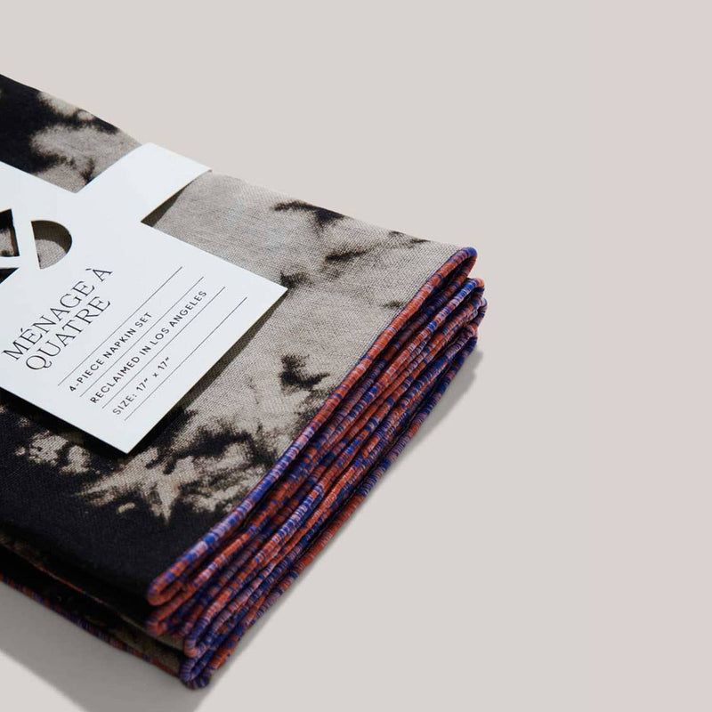 ATELIER SAUCIER - Sundown Linen Napkins | Set of 4: Black-and-gray marbled napkins, 17x17, with vibrant colored edges, wrapped in a white band, reclaimed in Los Angeles.