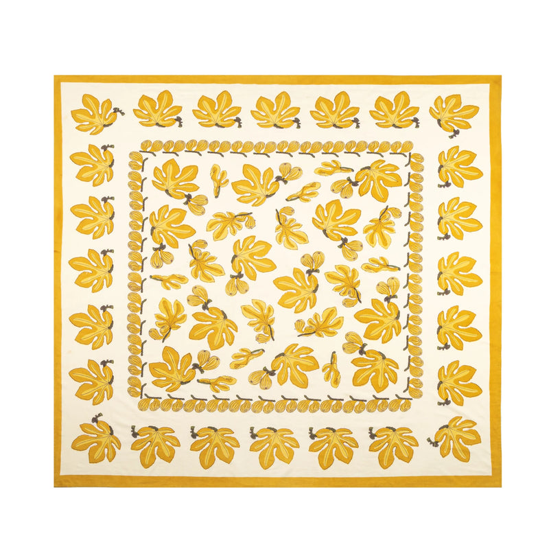 Caravan Home Fig Citrine Tablecloth, 71 x 71, featuring a yellow and white leaf pattern, ideal for adding a touch of elegance to your kitchen decor.