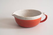 RachaelPots - Salad Dressing Bowl: Pink, a red and white speckled ceramic bowl with a garlic scraper, handle, and pour spout, ideal for dressings and marinades.