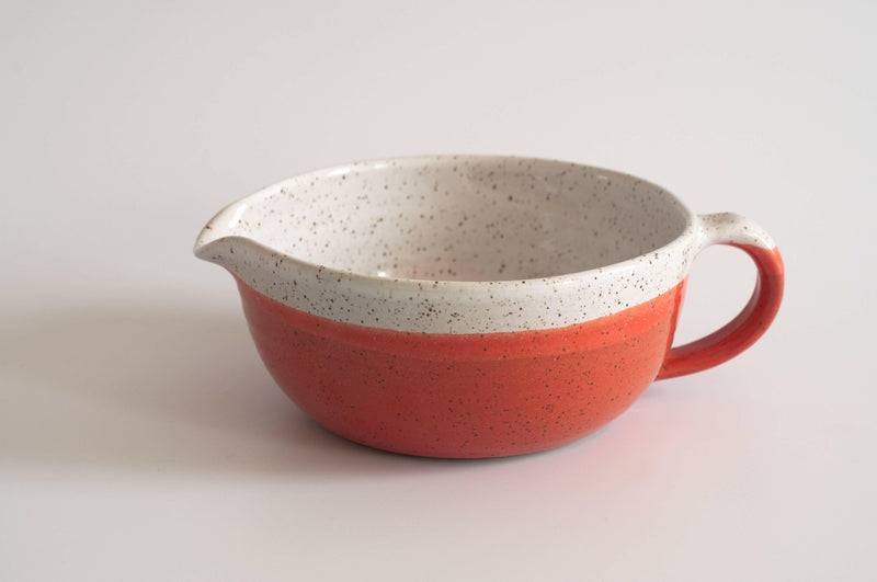 RachaelPots Salad Dressing Bowl - Nude, a versatile hand-thrown ceramic piece with a garlic scraper, pour spout, and handle, perfect for making dressings or guacamole.