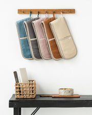 MagicLinen - Double oven mitts: Natural Gingham hanging on a wall, designed for heat protection and sustainability from excess linen, ideal for kitchen use.