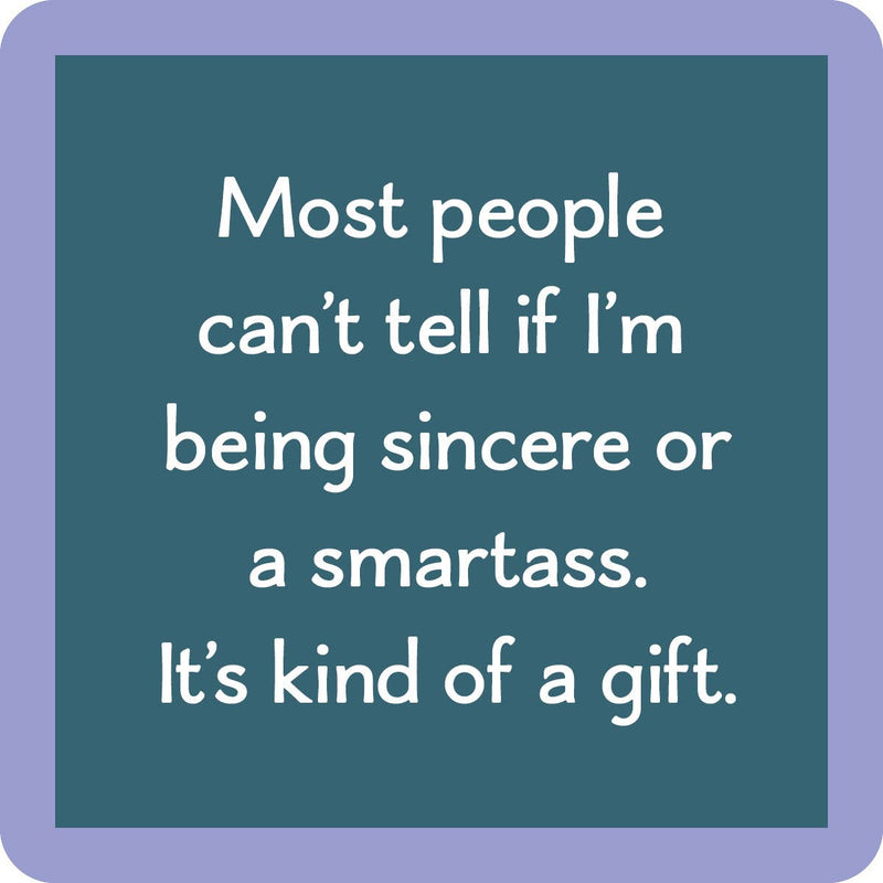 Teal-blue coaster with the phrase “Most people can’t tell if I’m being sincere or a smartass. It’s kind of a gift.” from Drinks on Me.