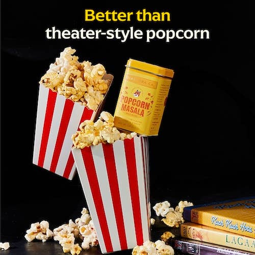 Diaspora Co. Spices - Popcorn Masala displayed with popcorn in striped boxes, highlighting its unique spice blend for an elevated snacking experience.