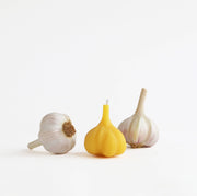 Artifaqt - Garlic Beeswax Candle, shaped like garlic bulbs, offers a honey aroma. Crafted from Chester County beeswax, ideal for eco-conscious homes.