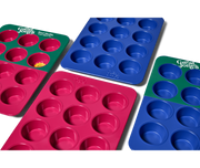 Great Jones | Stud Muffin - Blueberry: A close-up of a nonstick, nontoxic muffin pan with 12 holes, designed for even heat distribution and easy cleanup.