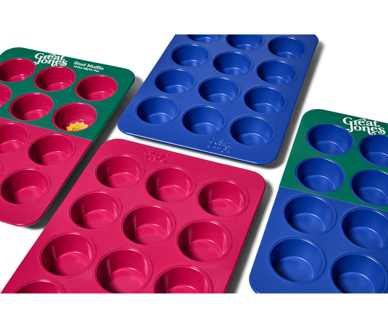 Great Jones | Stud Muffin - Blueberry: A close-up of a nonstick, nontoxic muffin pan with 12 holes, designed for even heat distribution and easy cleanup.