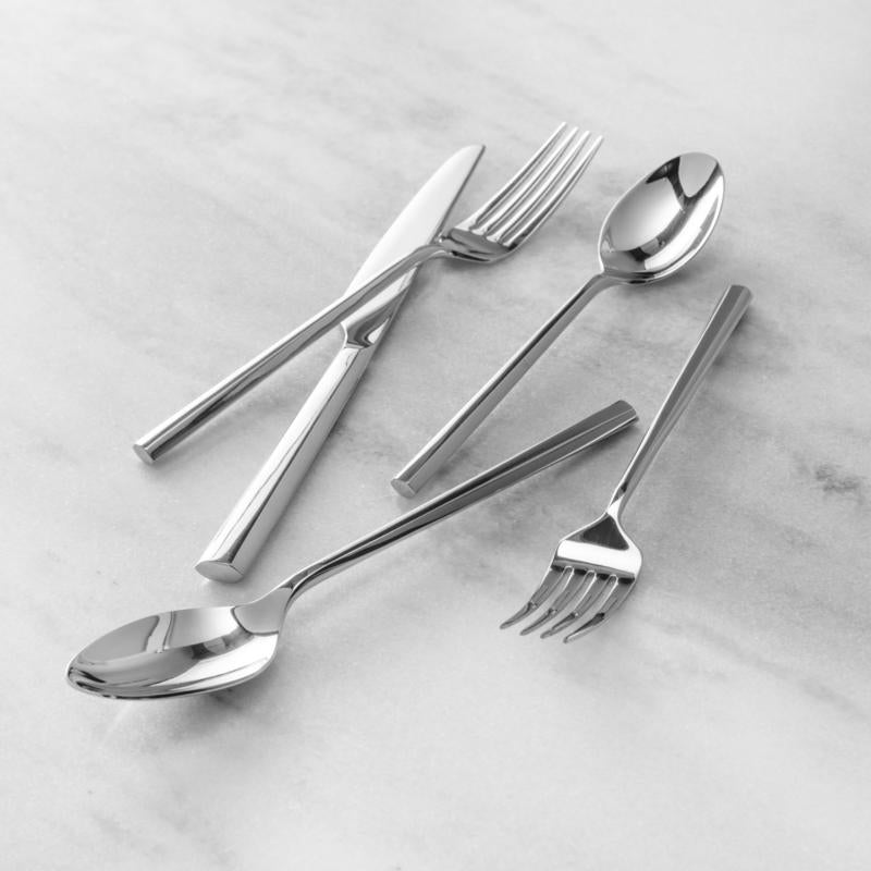 Fortessa | Orson 5 piece Place Setting featuring elegant silverware including a spoon, fork, and knife, displayed on a marble surface. Ideal for sophisticated dining.
