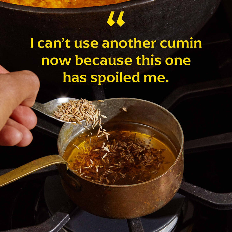 Copper saucepan with hot oil, ready for tempering with Diaspora Spices Co.'s Jodhana Cumin seeds, highlighting its smoky, rain-like aroma and single-origin authenticity.