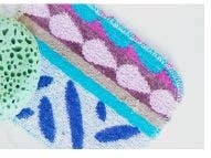 Euroscrubby - Original Euroscrubby 3 Pack: Close-up of colorful polymer-clay cane slices, showcasing vibrant patterns, highlighting the scrubby's versatile and eco-friendly cleaning capabilities for kitchen and beyond.