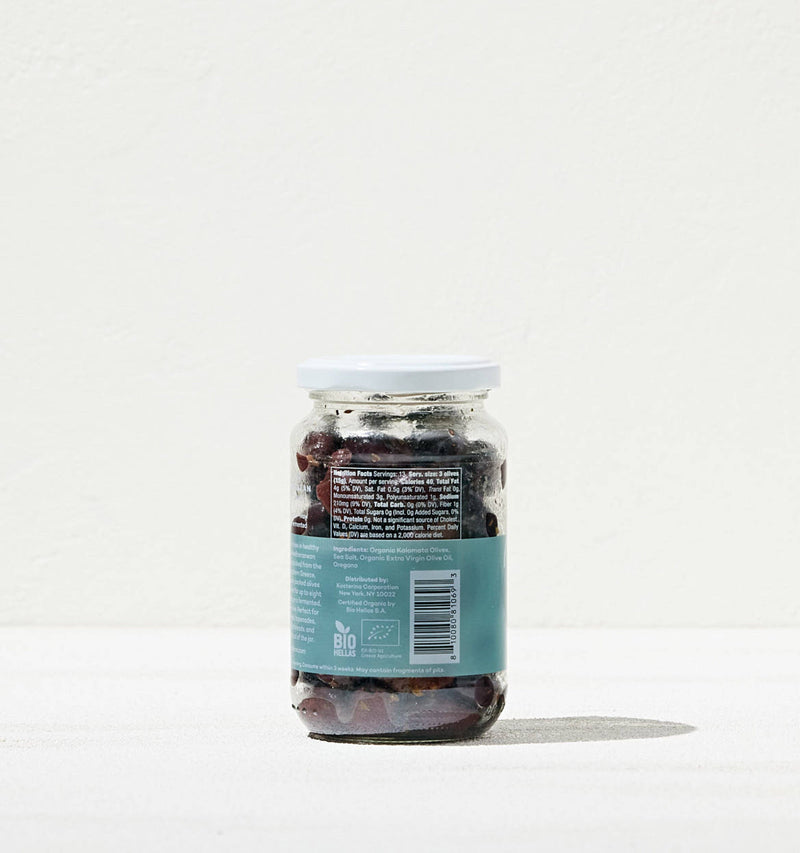 Kosterina - Greek Herb Kalamata Olives in a labeled jar, showcasing organic olives perfect for salads or snacking, embodying Athens Cooks' specialty food offerings.