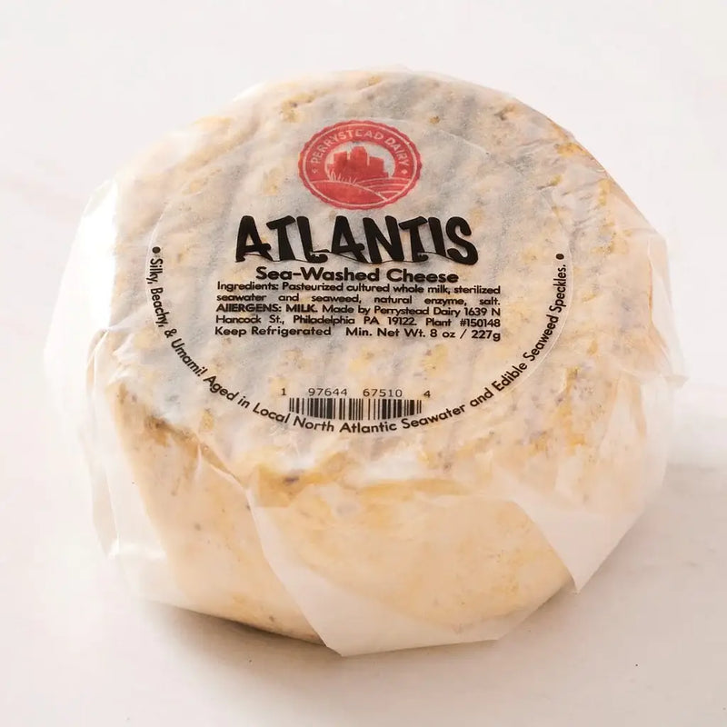 Perrystead Dairy - Atlantis cheese, 8 oz wheel, wrapped, labeled with sea-washed and seaweed details, awarded for its unique maritime flavors and quality.