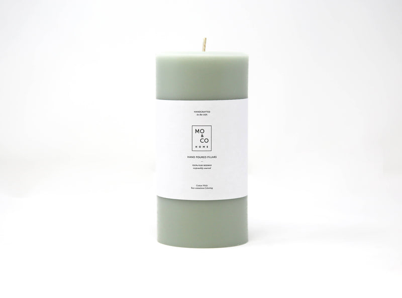 Mo&Co Home - 100% Beeswax Pillar Candle with Eucalyptus scent, featuring a white label, hand-poured for a clean and eco-friendly burn.